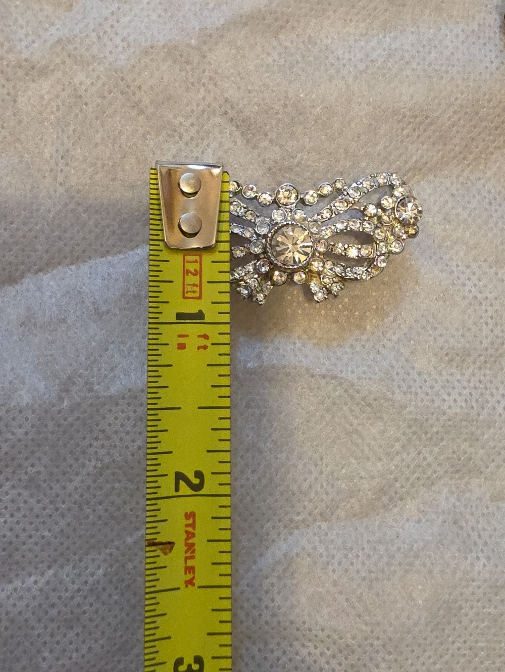 VIntage, silver-tone crystal rhinestone brooch with an ornate bow or wing-like f - Picture 5 of 5